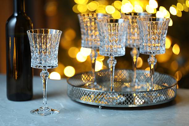 istock Wine in glasses and bottle on table against blurred lights. Bokeh effect 2252012670