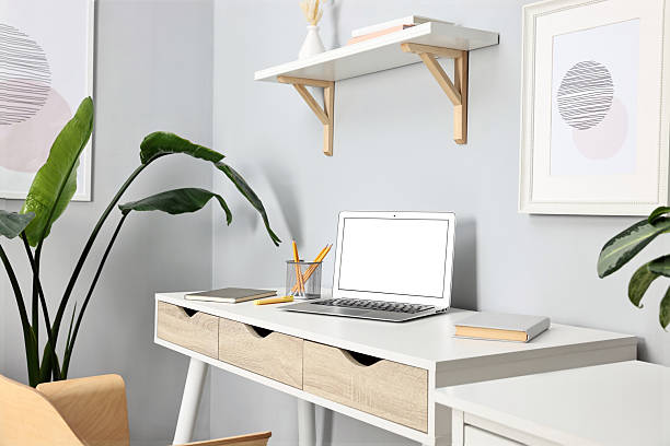 istock Comfortable workplace with modern laptop on white table indoors 2252013917