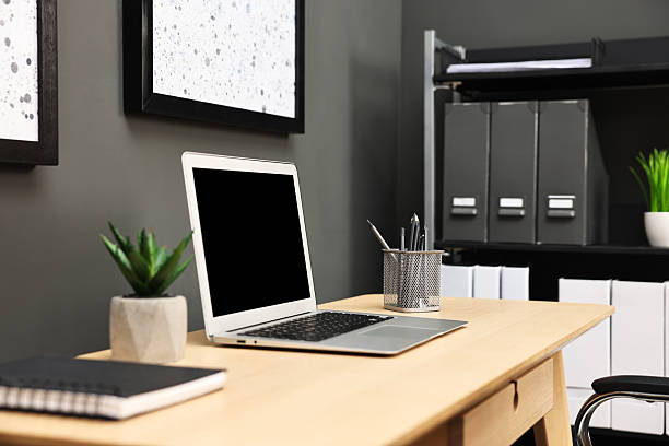 istock Comfortable workplace with modern laptop on wooden table indoors 2252013987