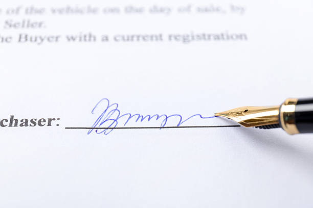 istock Fountain pen leaving signature on contract, closeup 2252014617