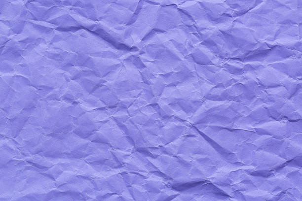 istock Purple crumpled paper surface macro,Abstract light lilac paper texture background. Texture of crumpled craft paper. Paper background. Recycled lilac paper backdrop in close up. purple Textures. Wallpaper. 2252014713