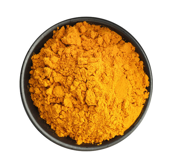 istock Turmeric powder in bowl isolated on white, top view 2252015200