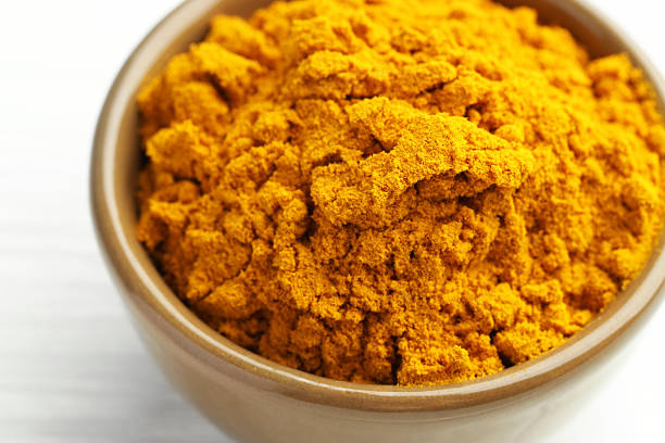 istock Turmeric powder in bowl on white table, closeup 2252015808
