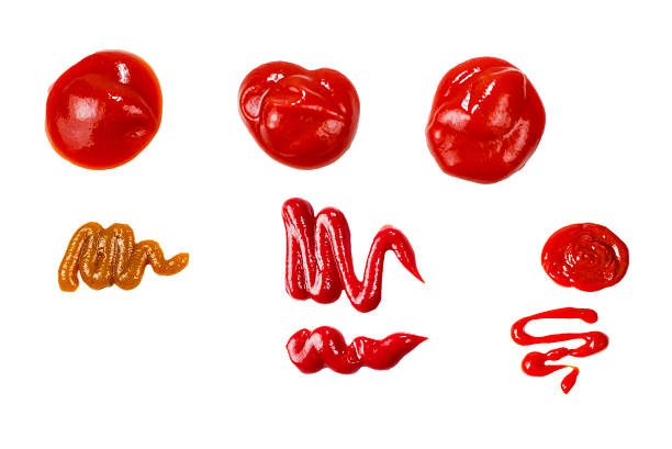 istock Red sauce splashes isolated on white background. Ketchup. 2252015937
