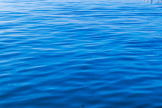An abstract background of seawater flow under light exposure