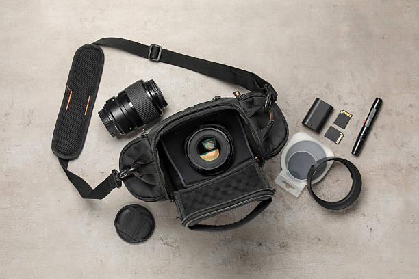 istock Professional photographer's equipment and case on light background, flat lay 2252016864