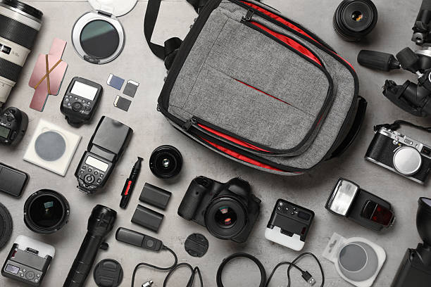 istock Professional photographer's equipment and backpack on light background, flat lay 2252016874