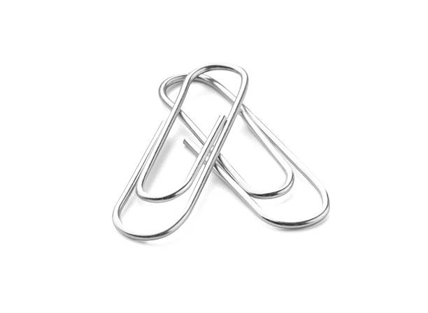 Two metal paper clips isolated on white