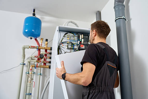 istock Technician open control unit to inspecting heat pump system in house 2252019204