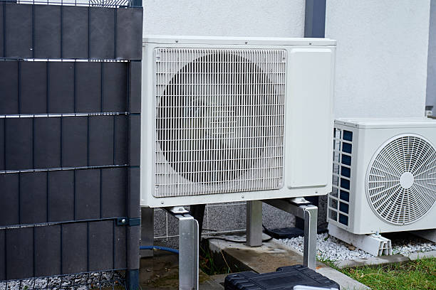 istock Outdoor heat pump unit with rotating fan blades 2252019222