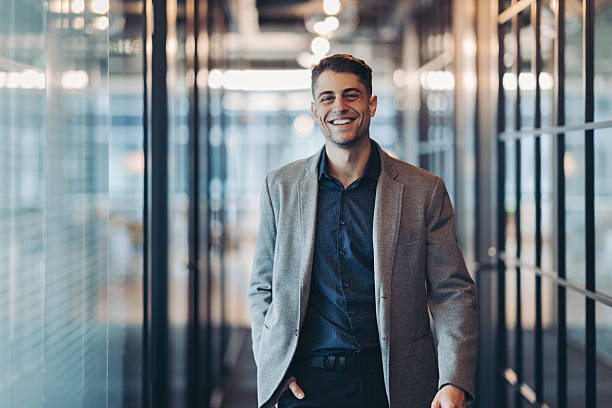 istock Smiling young man in walking confidently towards the camera 2252021211