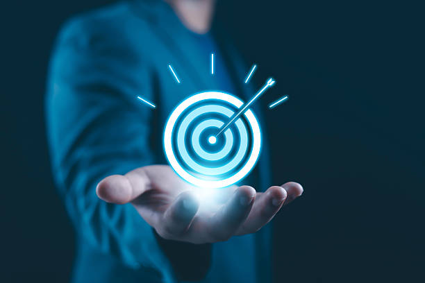 istock Focus and precision business concept with professional holding glowing digital target and arrow. Clear goal achievement, accuracy, strategic direction, success mindset modern technology background. 2252021833