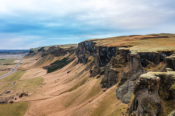 istock Dron view basalt cliffs, winding riverbeds and landscape in northeastern Iceland. Road, mountains. 2252022536