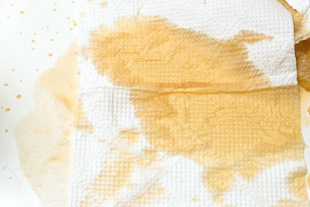 istock tissue absorbs spilled tea liquid on white background 2252023928