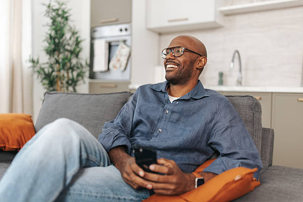 istock Man Relaxing with Pastry and Engaging Smile 2252030973