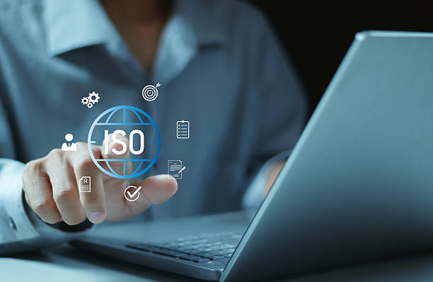 istock ISO Certification concept. Quality assurance, compliance, global standards, and International organization. Person using laptop with ISO icon on virtual screen. 2252031963