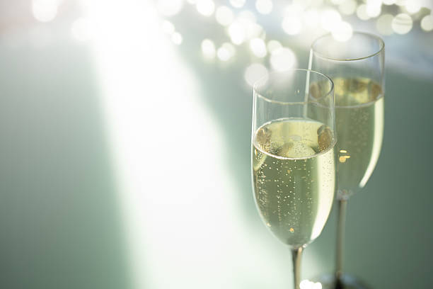 istock Elegant champagne glasses filled with sparkling wine 2252035257