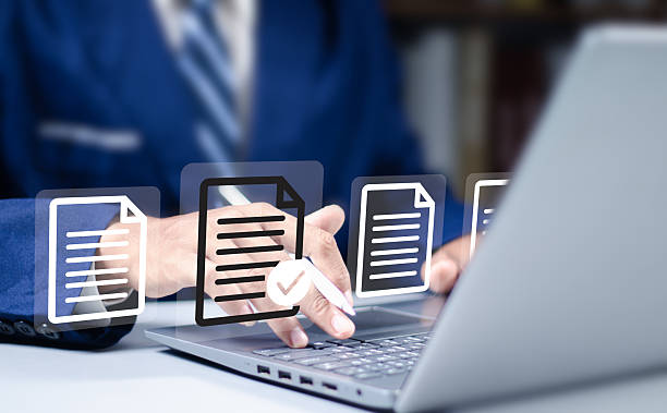 istock Using a laptop with a virtual screen and document for paperless quality assurance and online ERP clearance. 2252035922