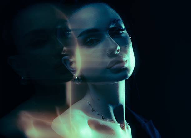 istock Double Exposure Woman Serious Portrait Blue Light 2252037999