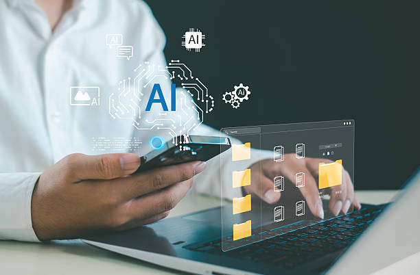 istock AI technology and digital data management concept with hands using smartphone and laptop, featuring virtual folders and AI icons representing automation, seamless information workflow. 2252038362