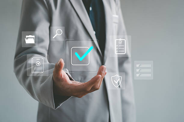istock Business compliance and verification concept with a hand presenting checkmark icons, representing approval, quality assurance, document review, security validation, professional process management. 2252038617