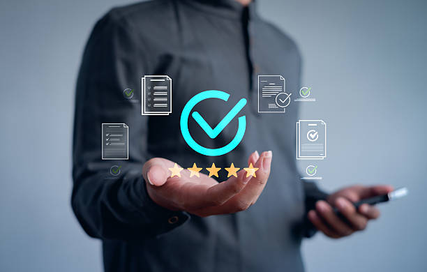 istock person presenting a digital approval checkmark with documents and five-star rating, symbolizing quality assurance, certification, customer satisfaction, and high-standard business performance. 2252038762