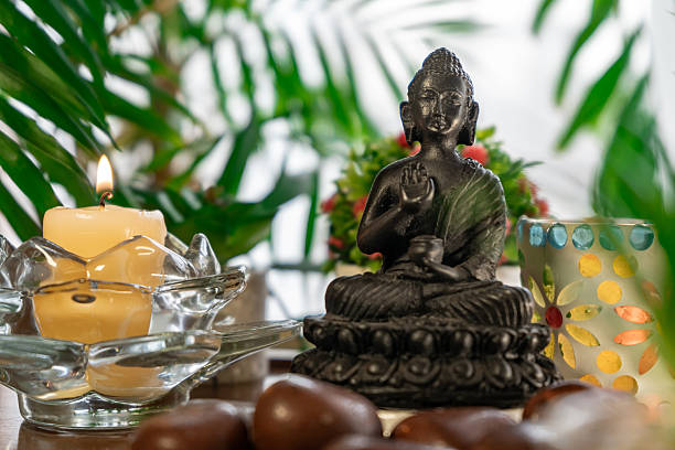 istock Meditation altar with Buddha statue, candles, plants 2252047182