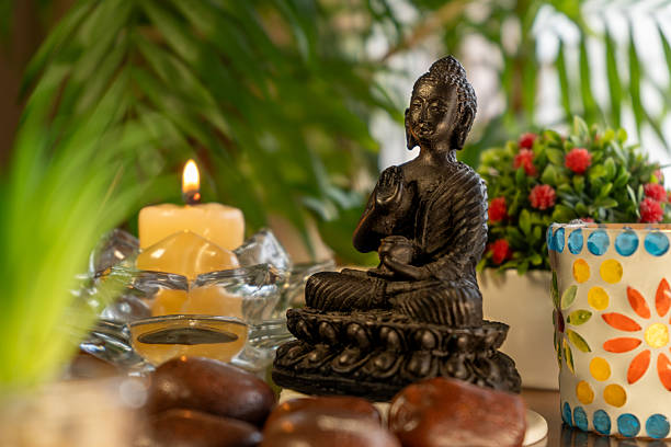 istock Meditation altar with Buddha statue, candles, plants 2252047208
