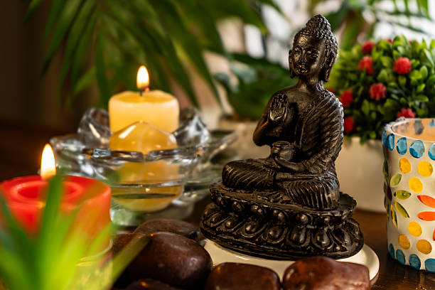 istock Meditation altar with Buddha statue, candles, plants 2252047212