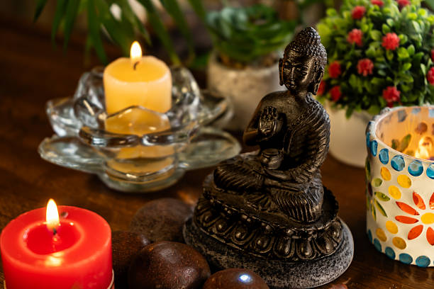 istock Meditation altar with Buddha statue, candles, plants 2252047215