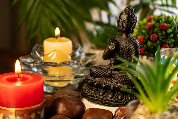 istock Meditation altar with Buddha statue, candles, plants 2252047216