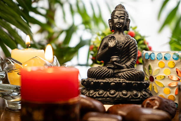 istock Meditation altar with Buddha statue, candles, plants 2252047225