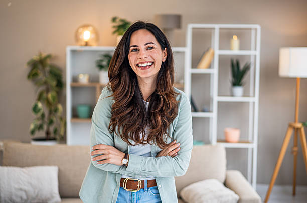 istock Happy woman smiling looking at camera at home 2252051371