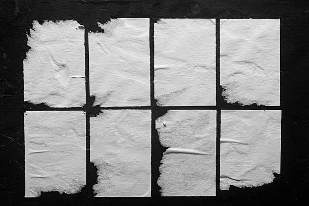 istock several white posters with folds on a black background 2252052488