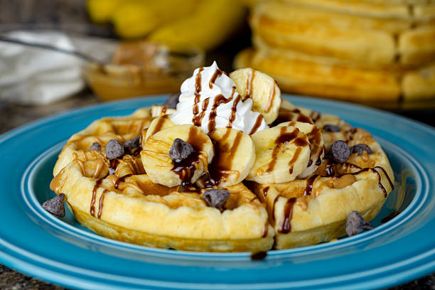 istock A golden waffle with bananas, peanut butter, chocolate syrup drizzle, and chocolate chips creates a decadent treat in Waukesha County, Wisconsin. 2252052829
