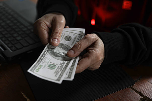 istock Secretive Figure Counting Illicit Earnings 2252054101