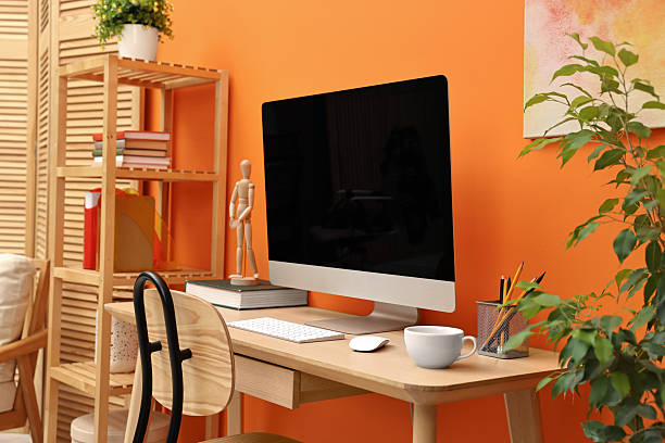 istock Comfortable workplace with modern computer and stationery on wooden table indoors 2252054632
