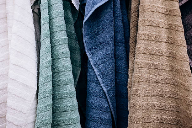 istock Hanging bathroom towels in assorted colors, close-up. 2252054935