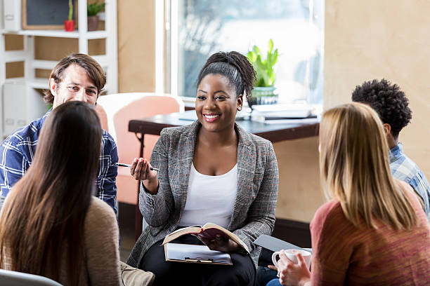 istock Diverse group engaging in a supportive therapy session facilitated by a professional. 2252056073