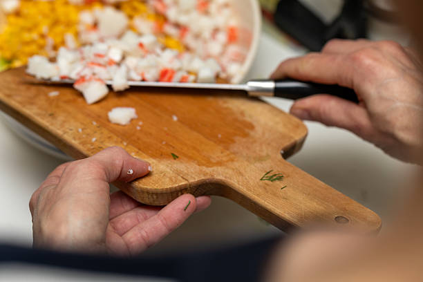 istock Preparing a delicious homemade crab stick salad 2252056281