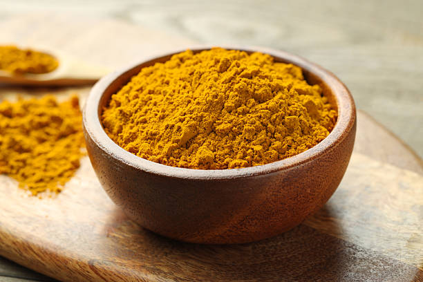 istock Turmeric powder in bowl on table, closeup 2252058013