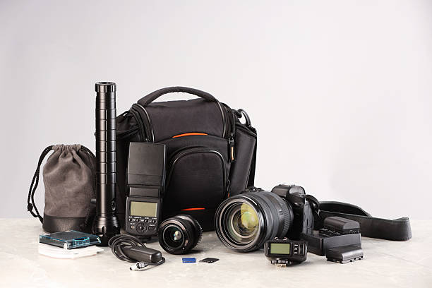 istock Professional photographer's equipment and case on light table. Space for text 2252058411