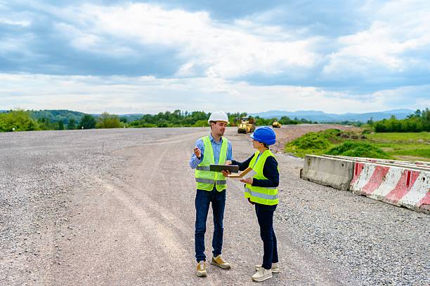 istock Engineer and investor on a road construction site 2252059491
