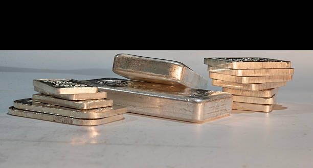 istock Closeup view of silver bars on table top 2252060111