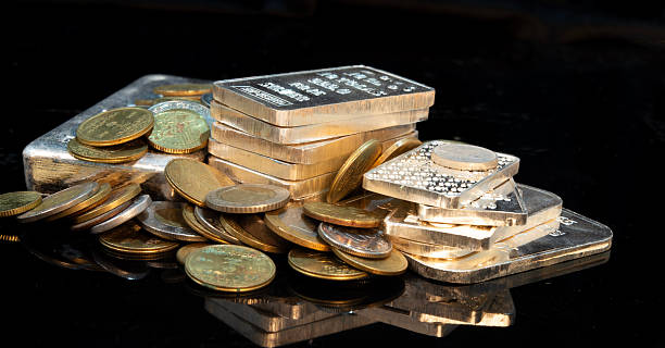Gold and Silver collectables on black banner.