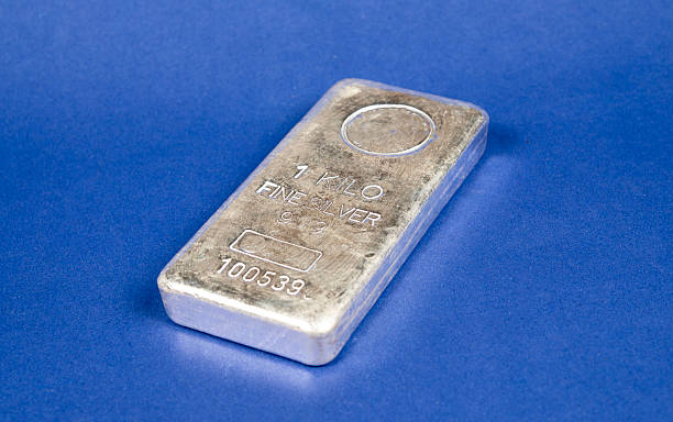 istock Closeup view of 1 Kilo Fine Silver Bar on blue banner 2252060133