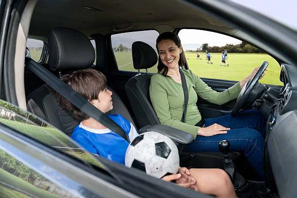 istock Happy soccer mom picking up her son from practice 2252061841