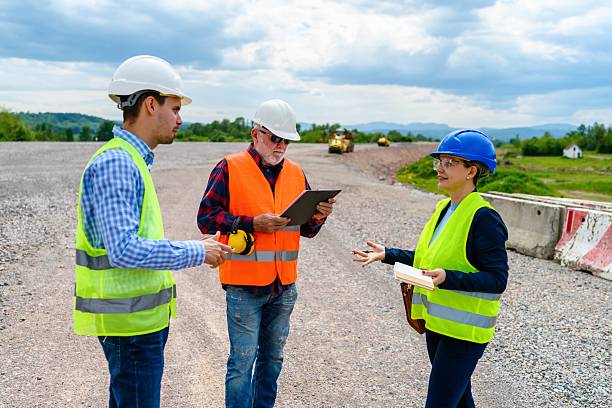 istock Engineers and investor on a road construction site 2252062330