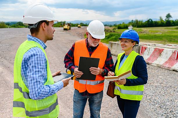 istock Engineers and investor on a road construction site 2252065537