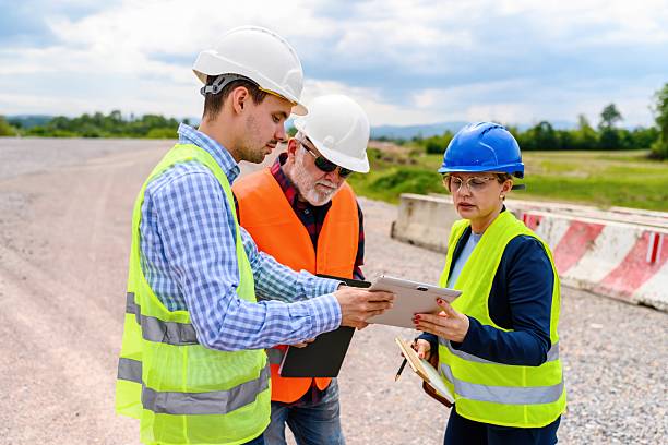 istock Engineers and investor on a road construction site 2252066118